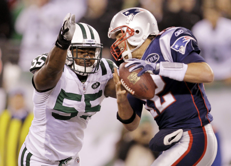 Jamaal Westerman of the Jets pressures Pats quarterback Tom Brady Sunday night in New Jersey. The Pats did most of the pressuring, however, winning 37-16.