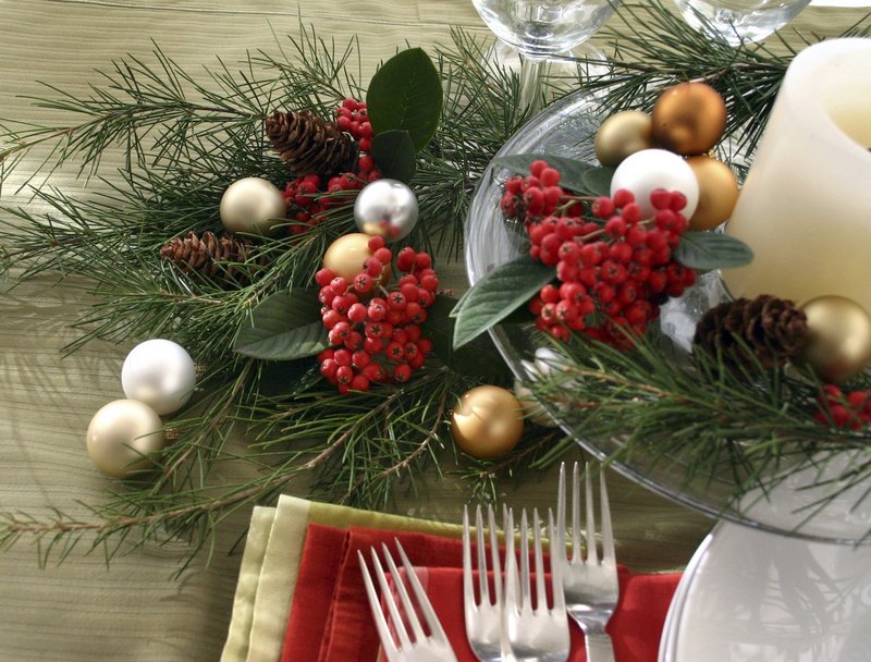 A festive table setting styled by Zelda Gordon. Piney greens can enhance your decor – and give off their fresh scent – all winter long.