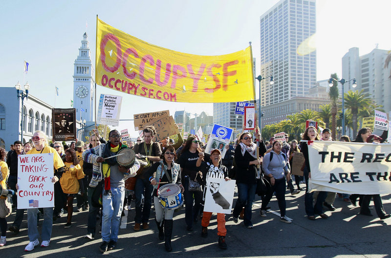Occupy protesters march along the Embarcadero as part of a demonstration in San Francisco on Wednesday.