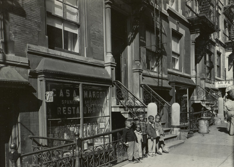 “Harlem, NY (5 boys leaning on fence),” 1946, vintage gelatin silver print on paper.