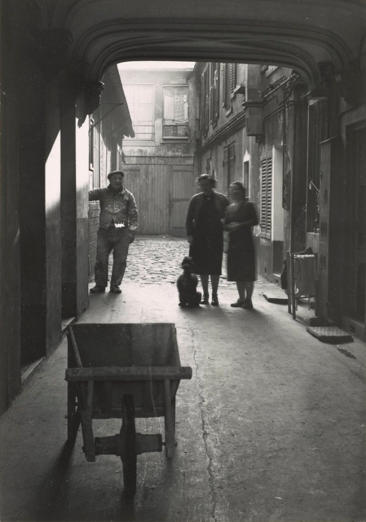 “Cour de Commerce, Paris (3 people in alleyway),” 1948, vintage gelatin silver print on paper.