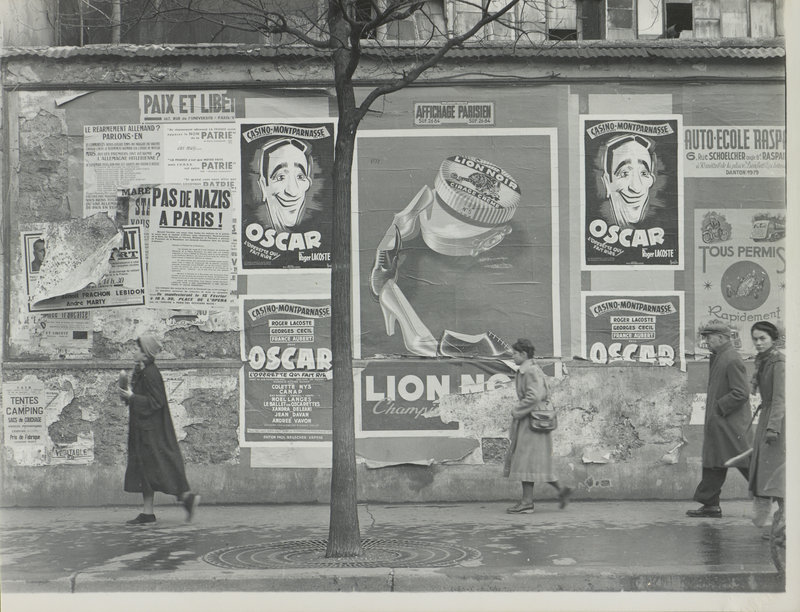 “Rue Alesia, Paris (Oscar billboards),” 1951, gelatin silver print on paper.