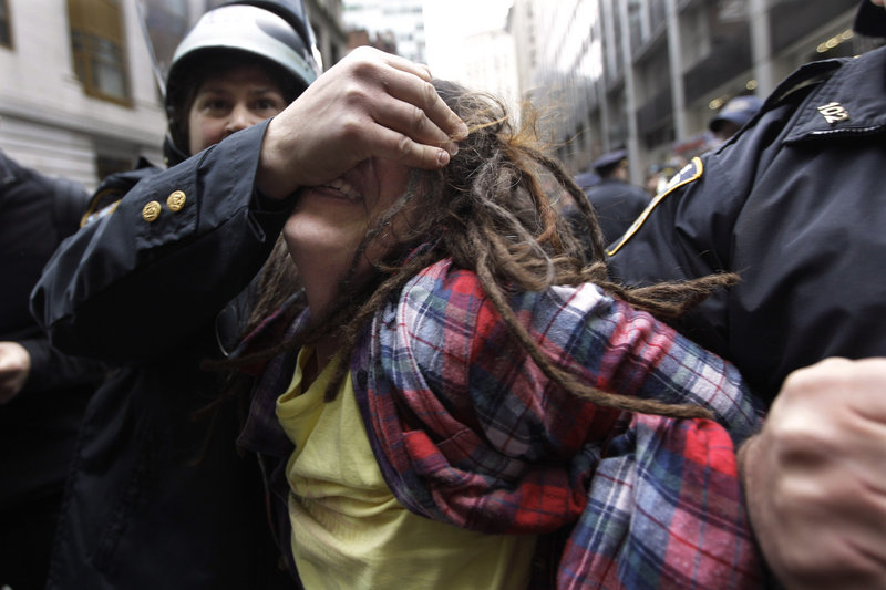 Police officers arrest a demonstrator affiliated with the Occupy Wall Street movement Thursday in New York.