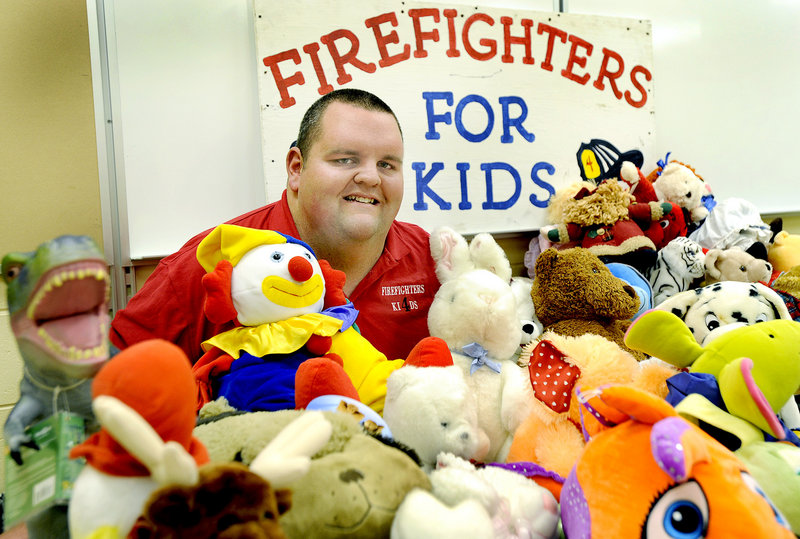 Kevin Foster is a Cumberland volunteer firefighter who started the Firefighters for Kids toy drive. He's shown with some toys to be given out this year.