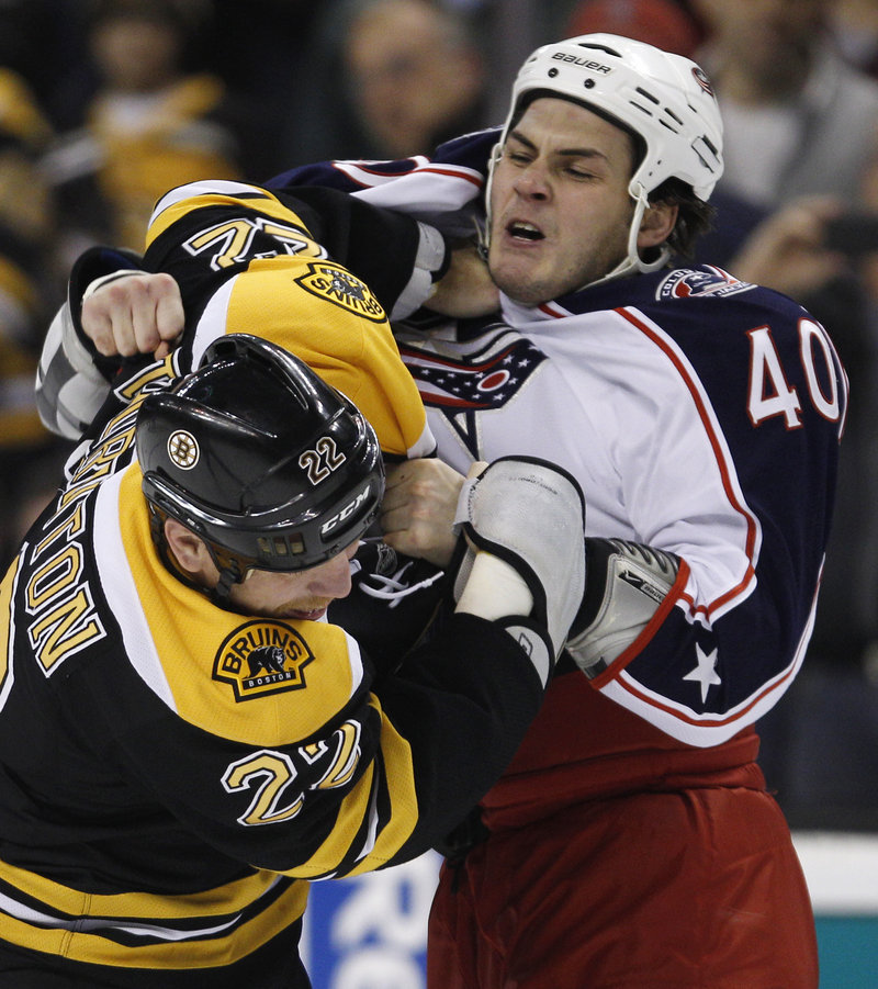Shawn Thornton, left, of the Bruins fights with Jared Boll of Columbus during Boston’s 2-1 win Thursday night at the TD Garden. The Bruins are 7-0 in November.