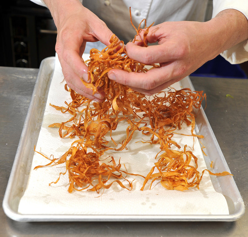 Chef Larry Matthews Jr. separates his crispy parsnips to keep them from clumping.