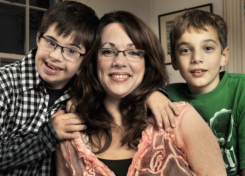 Nicole Thibodeau and her two sons, Michael, 13, left, and Andrew, 9, spend time together at their home in North Yarmouth. The single mother helped start a gym program so special-needs kids and their families can socialize and have fun. “The support from the community has been great,” she said.