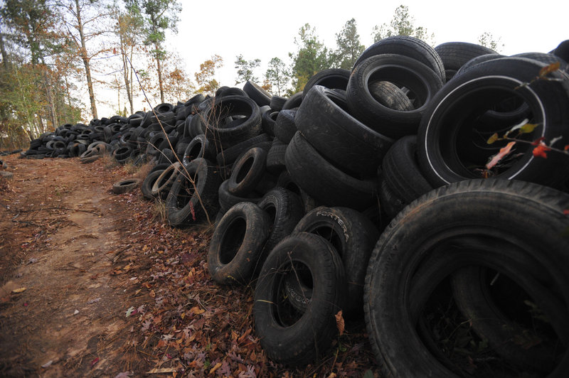 Dumped tires are piled near Elloree, S.C. The tires started piling up on county land in South Carolina, growing to a mound of about 1 million tires covering several acres of land.