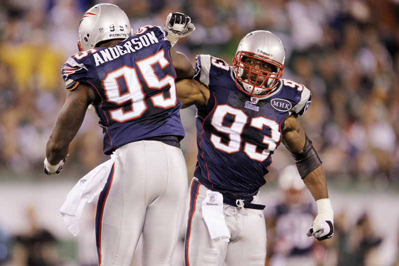 Andre Carter, right, matched a team record last Sunday for the New England Patriots when he had four sacks in a 37-16 victory over the New York Jets.