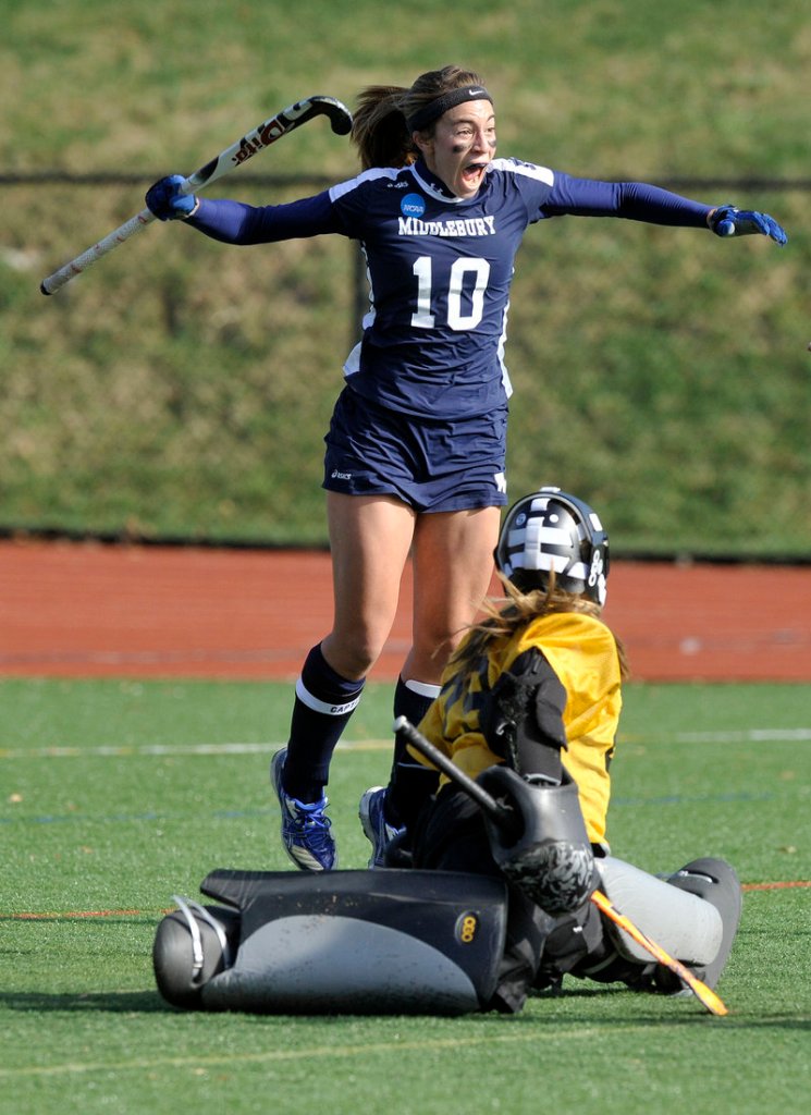 Lucy Jackson celebrates after scoring the first goal Saturday against Bowdoin's Kayla Lessard, starting Middlebury on its way to a 3-0 victory in an NCAA Division III field hockey semifinal.