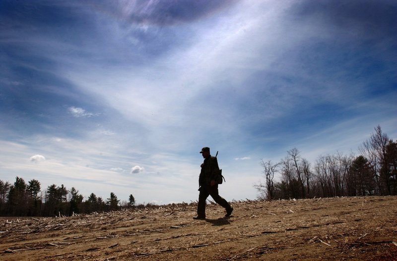 A hunter crosses a cornfield in Waldo in 2002, when nearly 41,000 nonresident hunting licenses were purchased. By 2010, that number had dropped to fewer than 28,000.