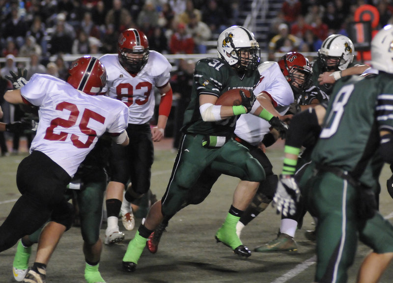 Jake Ouellette of Leavitt finds some running room against the Wells defense. Wells came away with the Class B championship with a 21-13 victory.