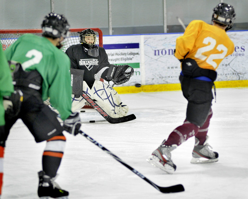 Cheverus goalie Kyle Severance takes shots during practice at the Portland Ice Arena.