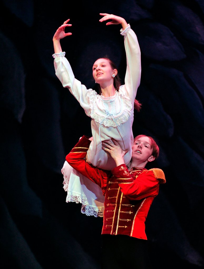 Michael Holden, right, portraying the Nutcracker Prince, lifts Elise Bickford, portraying Clara, during a rehearsal of “The Nutcracker.” Both are students at Falmouth High School.