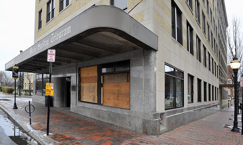 A stop-work order was issued on Tuesday after windows at the old Portland Press Herald/Maine Sunday Telegram building at Congress and Exchange streets were removed.