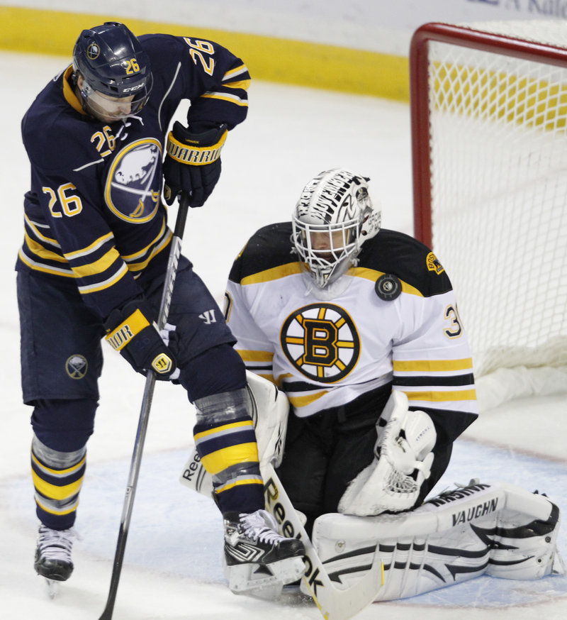 Boston goalie Tim Thomas blocks a shot by Thomas Vanek of the Buffalo Sabres in the first period Wednesday night. The Bruins increased their winning streak to 10 games.
