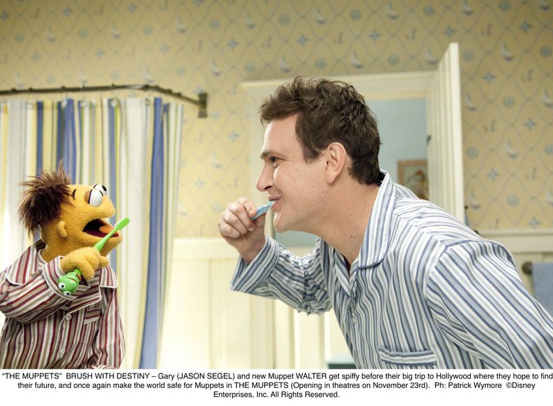 Gary (Jason Segel) and new Muppet Walter in “The Muppets.”