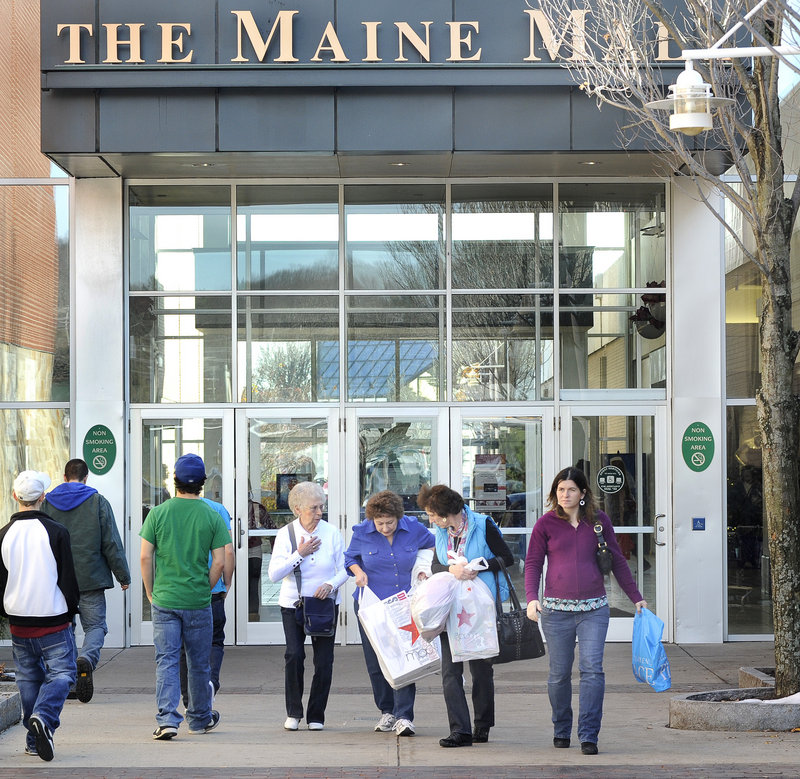 Family members Betty Willette of East Winthrop, Sandy Robinson of Penobscot, Sheree Wess of East Winthrop and Holly Wess of Madison compare notes Friday at the Maine Mall, where the crowds were well-behaved, the mall's general manager said.