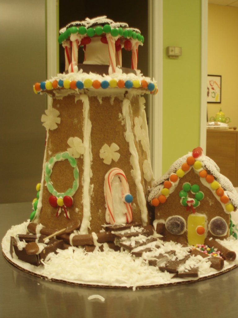 Michele Howard leads a Gingerbread lighthouse workshop where participants produce a sweet beacon like this one.