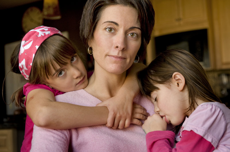 “I knew right then that our family couldn’t stay at this church anymore,” Jennifer Zickel says of her Catholic church’s decision to discontinue training altar girls. She is shown with daughters Natalie, 7, and Emily, 4, at home in Aldie, Va.