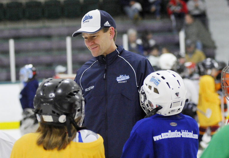 Want to know what's going on with UMaine? A couple of kids go right to the source – Coach Tim Whitehead – during a clinic Friday at Family Ice Center in Falmouth.