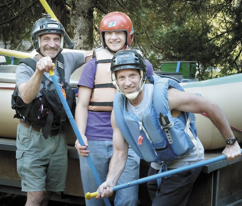 Ken Walsh, right, of Vassalboro, poses during a rafting trip this summer in Oregon that retraced a 2006 trip during which his cousin Spencer Funk, center, was bitten by a rattlesnake. Walsh ran five miles in darkness to summon help. At left is Spencer's father, Roger Funk.