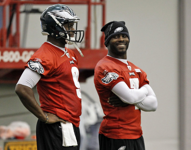 Regardless of whether Vince Young, left, or Michael Vick, right, is taking snaps for the Eagles today, New England knows it must be prepared for a quarterback who is capable of making big plays with both his arms and his legs.