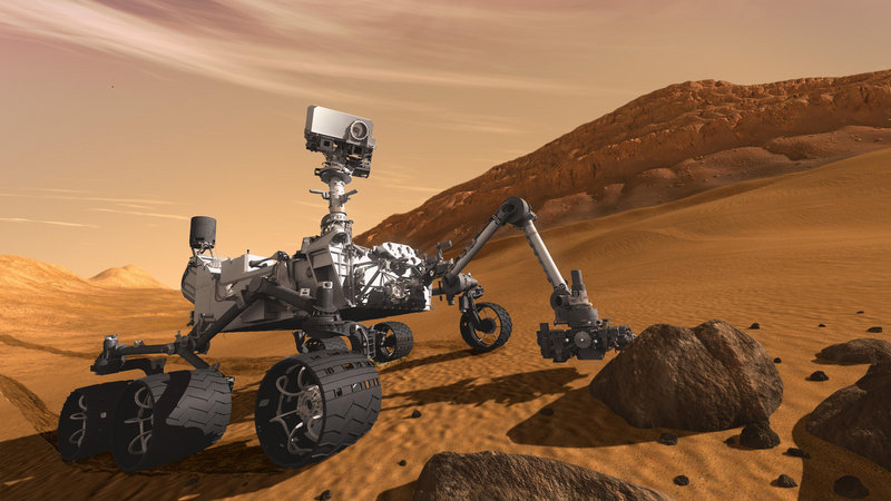 This 2011 artist's rendering depicts how the Mars Science Laboratory Curiosity rover would examine a rock on Mars. The six-wheeled mobile robot is designed to investigate Mars' past and present ability to sustain microbial life.