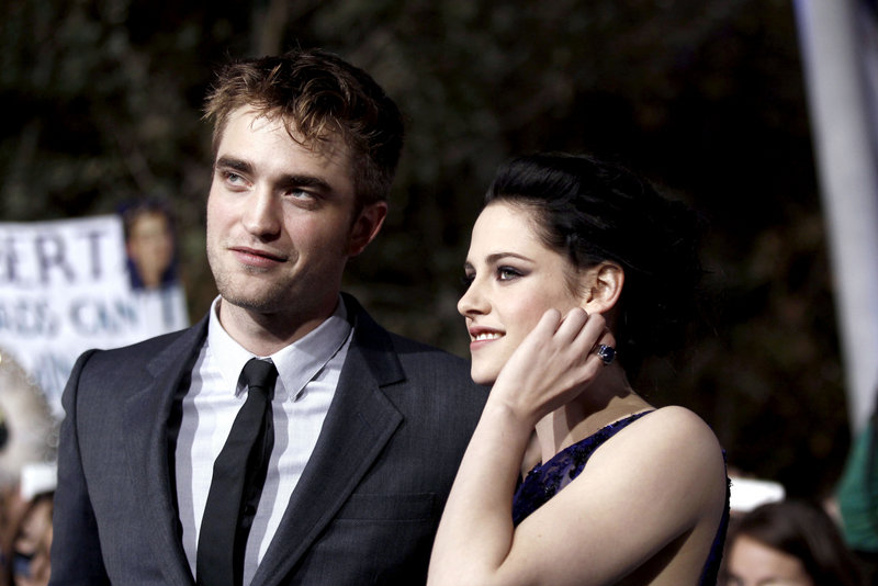 Co-stars Robert Pattinson and Kristen Stewart arrive at the world premiere of the latest movie in the “Twilight” series last week in Los Angeles.