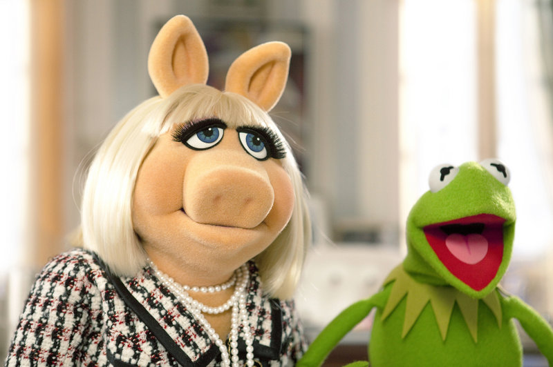 Kermit the Frog tries to persuade Miss Piggy to help save The Muppet Theater from being torn down in a scene from “The Muppets.” The movie debuted at No. 2 at the three-day weekend box office.