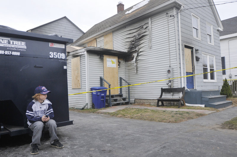 "Not a good weekend," said Max Calkins, 10, sitting in front of his burned-out home in South Portland.