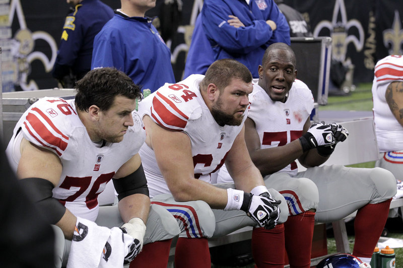 New York Giants center David Baas, 64, and teammates are not pleased during the fourth quarter of their 49-24 loss Monday night to the New Orleans Saints. The Giants, who have lost three straight, are a game behind the Dallas Cowboys in the NFC East and face Green Bay on Sunday.