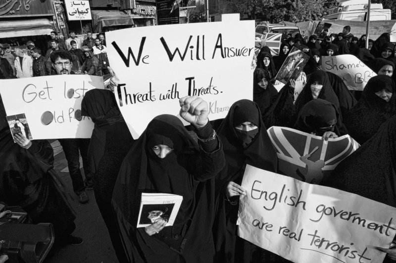 Iranian women attend an anti-British demonstration in front of the British Embassy in Tehran on Tuesday. Hundreds of people stormed the embassy, bringing down the British flag and tossing documents out windows in scenes reminiscent of the 1979 seizing of the U.S. Embassy.