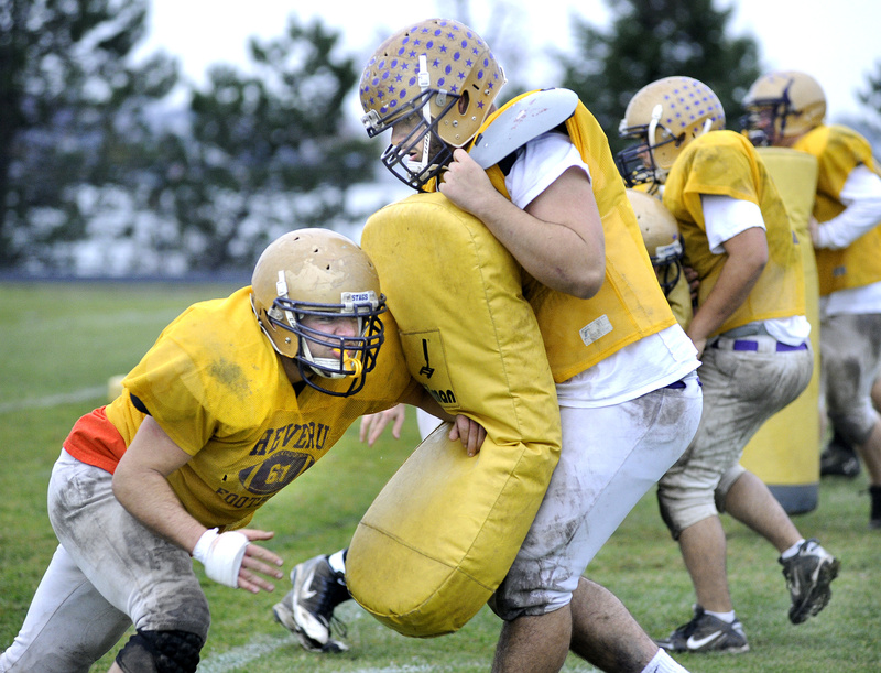 Mike Dedian does the rushing and Christian Deschenes uses the equipment. It’s only practice, but the two also have worked together on the line during games, and are two of the four co-captains for a Cheverus football team seeking a second consecutive Class A championship Saturday.