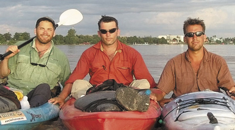 Filmmakers Hutch Brown, left, and Brian Eustis, right, have strong ties to Maine. Also shown is the film's director Mick O'Shea, center. They paused for a photo on the Laos-Thailand border during their trip down the 2,800-mile Mekong River in 2004.