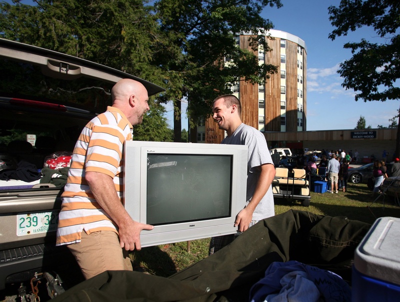 Bert Holmberg, left, and his son Karl of Newton, N.H., unload a trailer as they move family member Jillian into Dickey-Wood Hall at the University of Southern Maine in Gorham in 2010. With the attractions of Maine at its disposal and the demand for higher education high, the university should be able to fill its classes with out-of-state and foreign students, who would pay higher non-resident tuition and support valuable programs.