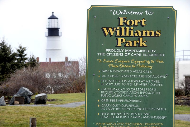 Signs specifying a drinking ban are displayed inside Fort Williams Park. Beer will be sold during a state troopers’ picnic at the park in 2012; the town picnic permit includes strict conditions.