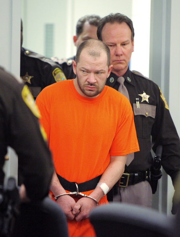 David Hobson, 34, of Alfred is led into Ossipee (N.H.) District Court on Wednesday for his arraignment on a felony escape charge. Hobson, the focus of an intense five-day manhunt after his escape from an Ossipee jail last week, was caught Tuesday night in Rochester, N.H.