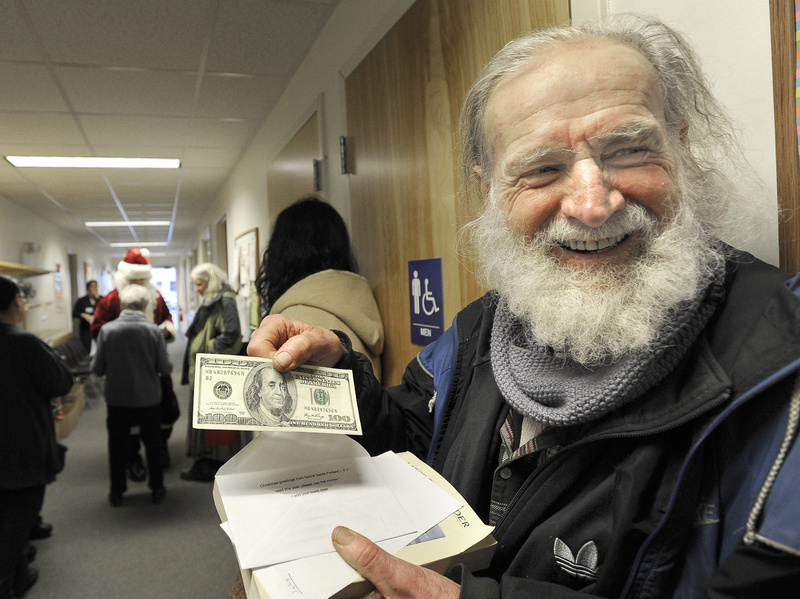 “I’m a rich man,” said Sean Donovan of Woolwich after an assistant for Portland’s Secret Santa handed him a $100 bill Wednesday at the Mid Coast Hunger Prevention Program in Brunswick. In all, Santa planned to give away $20,000 in cash gifts in four Maine cities this week.