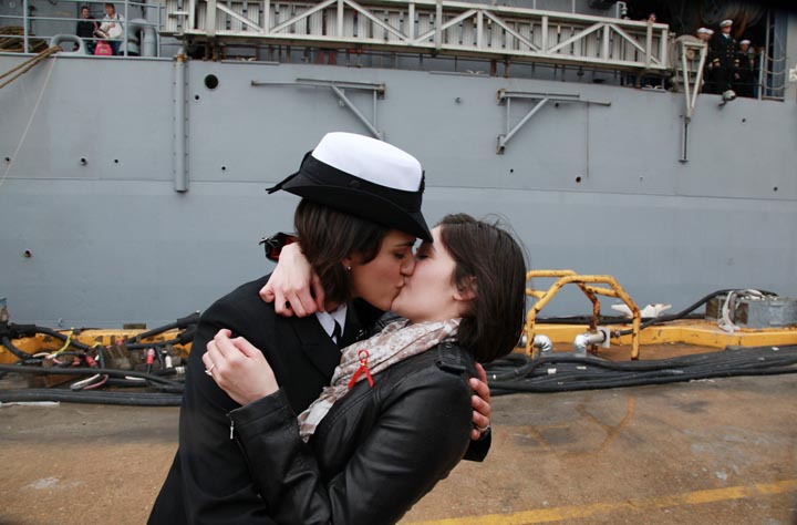 Petty Officer 2nd Class Marissa Gaeta, left, kisses her girlfriend of two years, Petty Officer 3rd Class Citlalic Snell at Joint Expeditionary Base Little Creek in Virginia Beach, Va., today after Gaeta's ship returned from 80 days at sea. It 's a time-honored tradition at Navy homecomings – one lucky sailor is chosen to be first off the ship for the long-awaited kiss with a loved one. Today, for the first time, the happily reunited couple was gay.