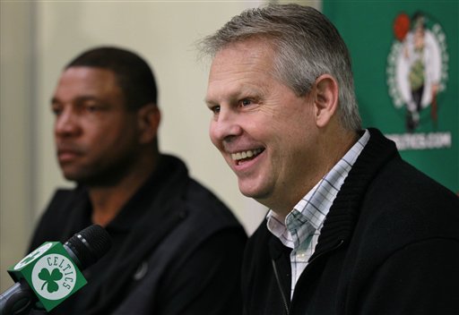 Boston Celtics Basketball Operations President Danny Ainge, right, and Celtics NBA basketball coach Doc Rivers, left, face reporters at the teams practice facility during a news conference, in Waltham, Mass., Thursday, Dec. 1, 2011. (AP Photo/Steven Senne)
