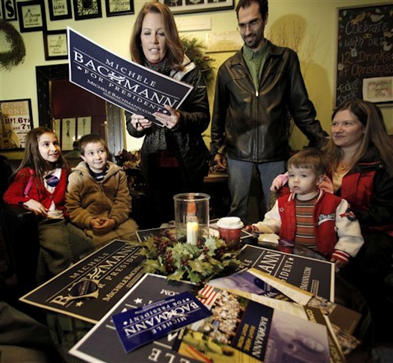 Republican presidential candidate, Rep. Michele Bachmann, R-Minn., signs an autograph during a campaign stop in Centerville, Iowa, in this Dec. 23, 2011 file photo. After a brief respite for Christmas, the Republicans in search of their party's presidential nomination return to the campaign trail for a final push ahead of the Iowa caucuses. (AP Photo/Charlie Riedel, File)