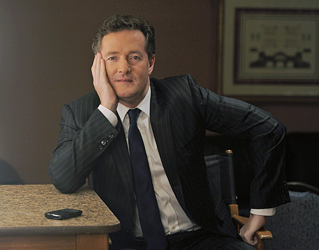 FILE - This Thursday, Jan. 6, 2011 file photo shows Piers Morgan, host of CNN's "Piers Morgan Tonight," posing for a portrait in Pasadena, Calif. Morgan will talk via video link Tuesday Dec 20 2011 about his former job as editor of one of Britain's troubled tabloids at a judge-led inquiry in London into the practices of Britain's scandal-tarred press. (AP Photo/Chris Pizzello, File)
