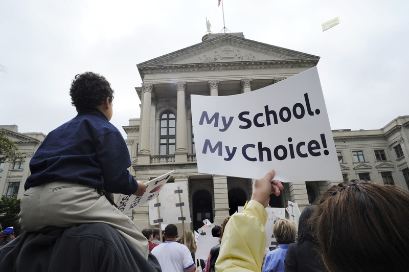 Students and parents gather in front of Georgia's Capitol in May to protest a ruling by the Georgia Supreme Court that disallowed the creation of state-approved charter schools. The popularity of charter schools has skyrocketed.