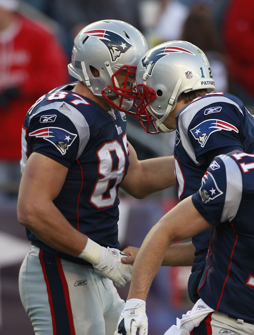 Rob Gronkowski, left, and quarterback Tom Brady celebrate after Gronkowski caught a touchdown during the third quarter against the Colts today.