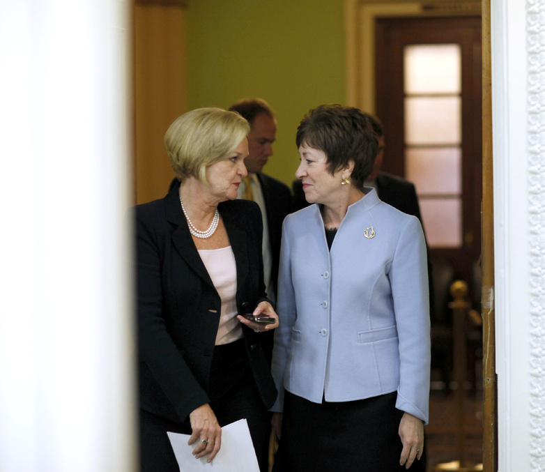 Sens. Susan Collins, R-Maine, right, and Claire McCaskill, D-Mo., head to a press conference Tuesday to unveil a bill to maintain a 2 percent payroll tax cut for 2012.
