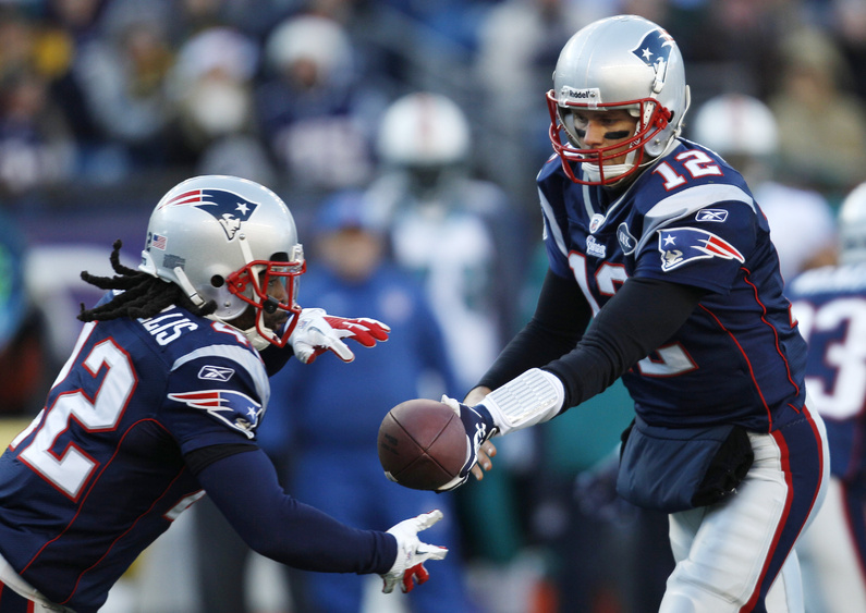 Patriots quarterback Tom Brady hands off to running back BenJarvus Green-Ellis against the Miami Dolphins on Saturday. The Patriots won 27-24.