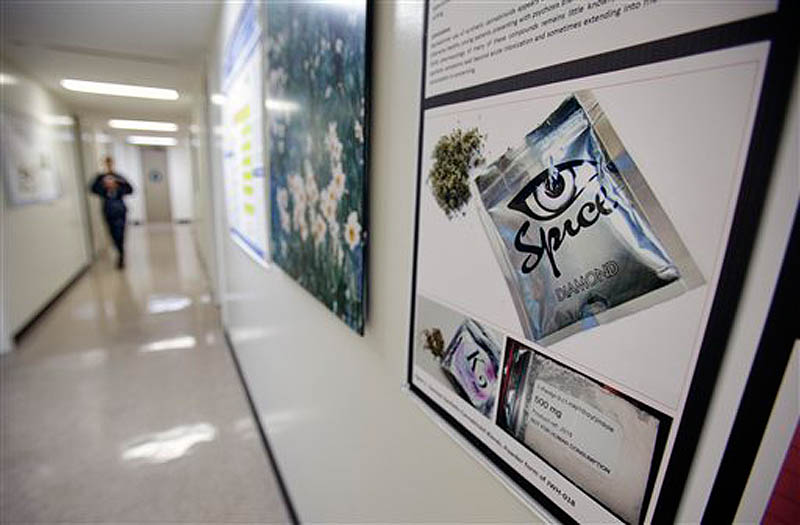 In this photo taken Tuesday, Dec. 6, 2011, a poster warning of the effects of the drug known as 'spice' hangs on a wall at the Naval Hospital, in San Diego. The U.S. Navy has kicked out a record number of sailors and Marines this year for smoking synthetic marijuana and is seeing a dramatic jump in emergency room visits of its users, including some who babbled or hallucinated for eight days. (AP Photo/Gregory Bull)