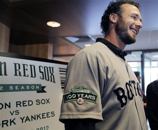 Boston Red Sox baseball catcher Jarrod Saltalamacchia chats with attendees of a news conference at Fenway Park in Boston Thursday, Dec. 8, 2011. Red Sox players will wear a patch on their uniform sleeve during the 2012 season to commemorate the 100th anniversary of Fenway Park, the oldest operating Major League Baseball park in the United States. (AP Photo/Elise Amendola)