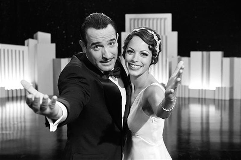 In this film publicity image released by The Weinstein Company, Jean Dujardin portrays George Valentin, left, and Berenice Bejo portrays Peppy Miller in a scene from "The Artist." (AP Photo/The Weinstein Company)